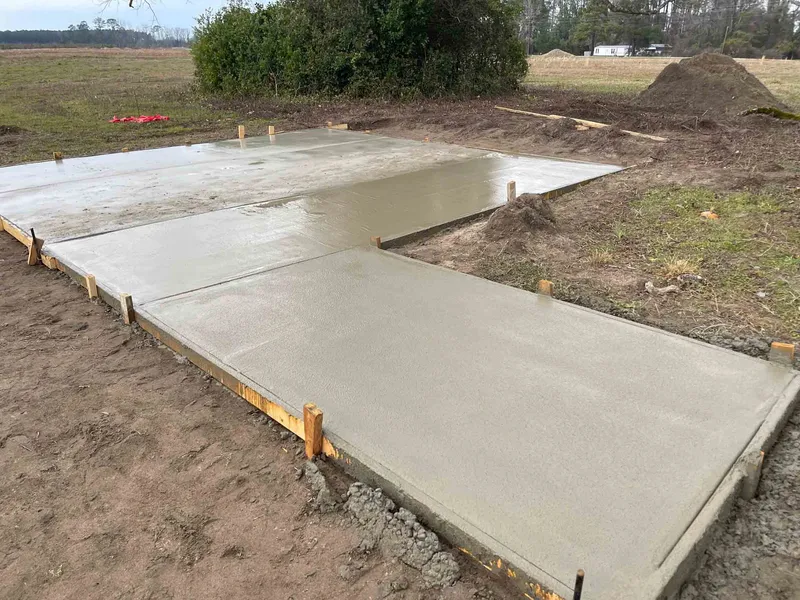 Concrete pad and adjoining walkway from Magnolia’s existing gallery